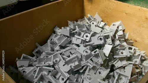 Plastic parts shop in a factory. Manufacturing of plastic parts and fittings for electric heaters in the factory. The machine stamps plastic parts