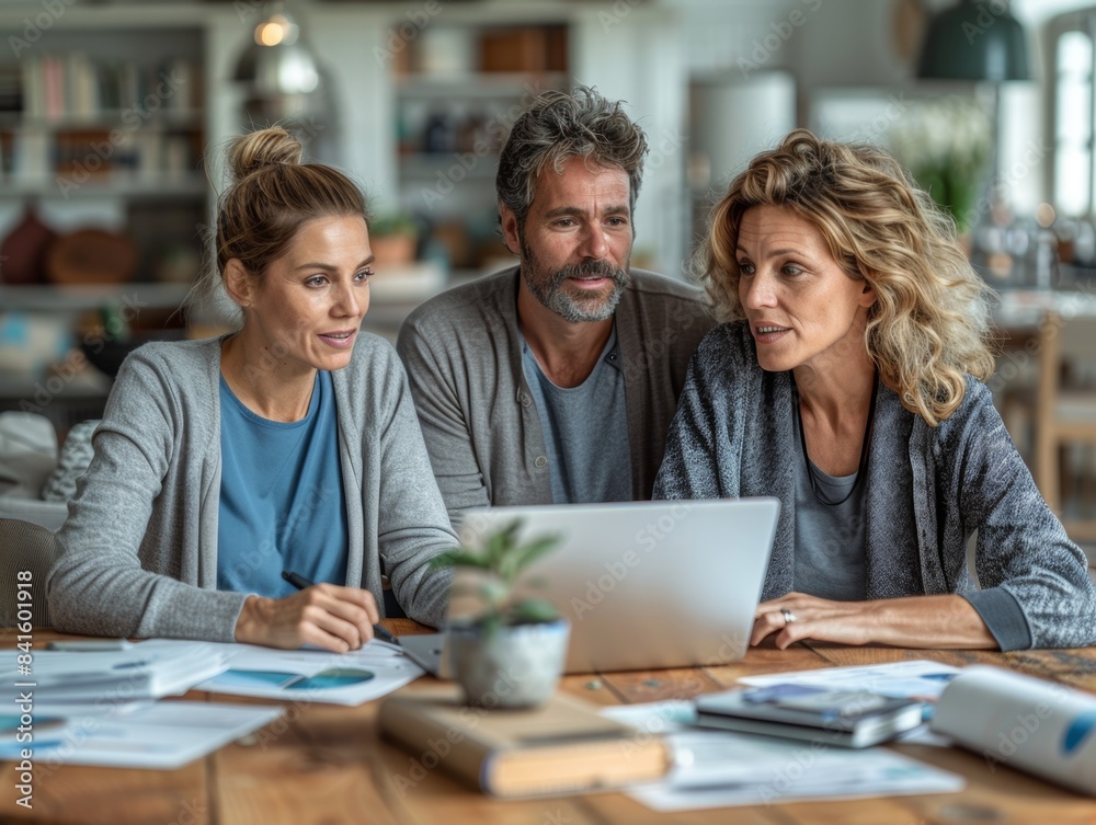 Strategic Financial Planning Meeting at Home with a Couple and Financial Consultant, Concept of Savings Goals and Investment Analysis Strategic Financial Planning Meeting at Home with a Couple and Financial Consultant, Concept of Savings Goals and Investment Analysis