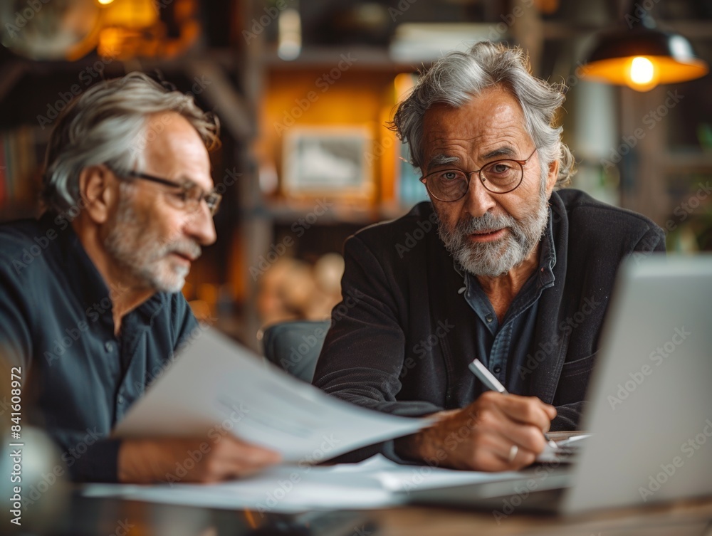Senior Man Consulting with Financial Planner for Retirement in Elegant Office Setting Senior Man Consulting with Financial Planner for Retirement in Elegant Office Setting