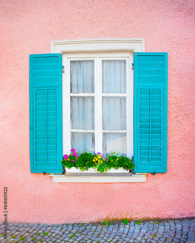 Obraz premium open window with green wooden shutters, pink texture wall