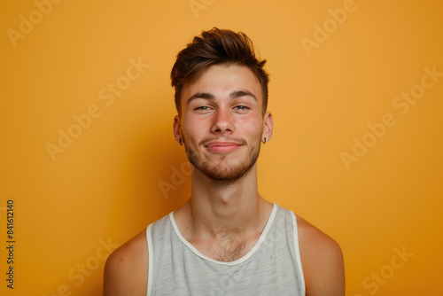 A close up portrait of a young man with a subtle smile © MagnusCort