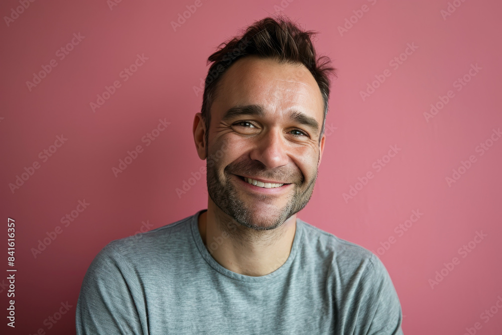 A close up portrait of a young man with a subtle smile A close up portrait of a young man with a subtle smile