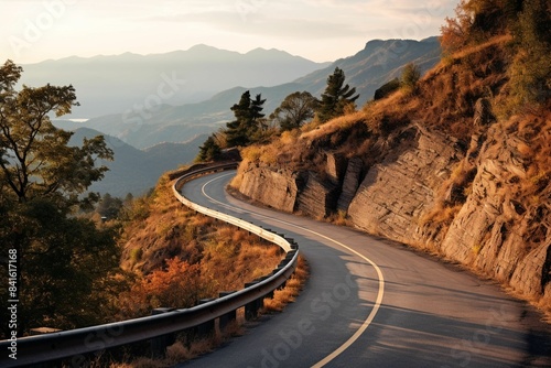Curving mountain road with mountain backdrop
