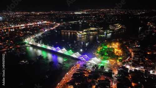 The coastal city of Nha Trang seen from above at night. This is a famous city for cultural tourism in central Vietnam photo