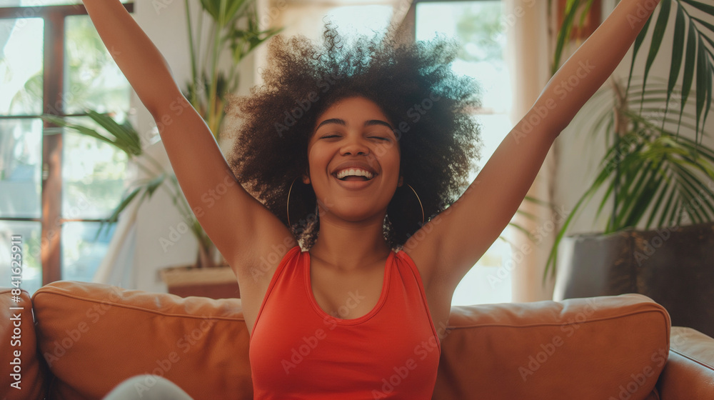 Happy Woman Celebrating with Arms Raised in Bright Living Room
Happy Woman Celebrating with Arms Raised in Bright Living Room