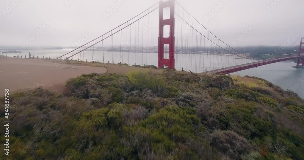 Aerial: Golden Gate Bridge at sunrise on a foggy morning, San Francisco, California, United States of America. Aerial: Golden Gate Bridge at sunrise on a foggy morning, San Francisco, California, United States of America.