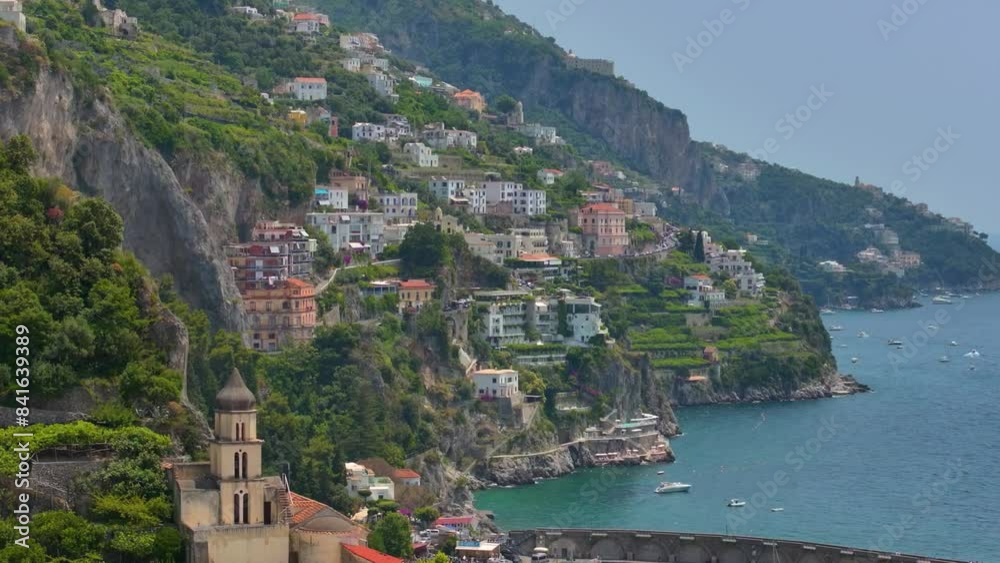 Aerial drone fly of Maiori resort village, Amalfi coast, Italy, Beautiful Italian Villa on a rocky seashore by the Porto di Maiori Aerial drone view of scenic Mediterranean Town with the blue sea. Aerial drone fly of Maiori resort village, Amalfi coast, Italy, Beautiful Italian Villa on a rocky seashore by the Porto di Maiori Aerial drone view of scenic Mediterranean Town with the blue sea.