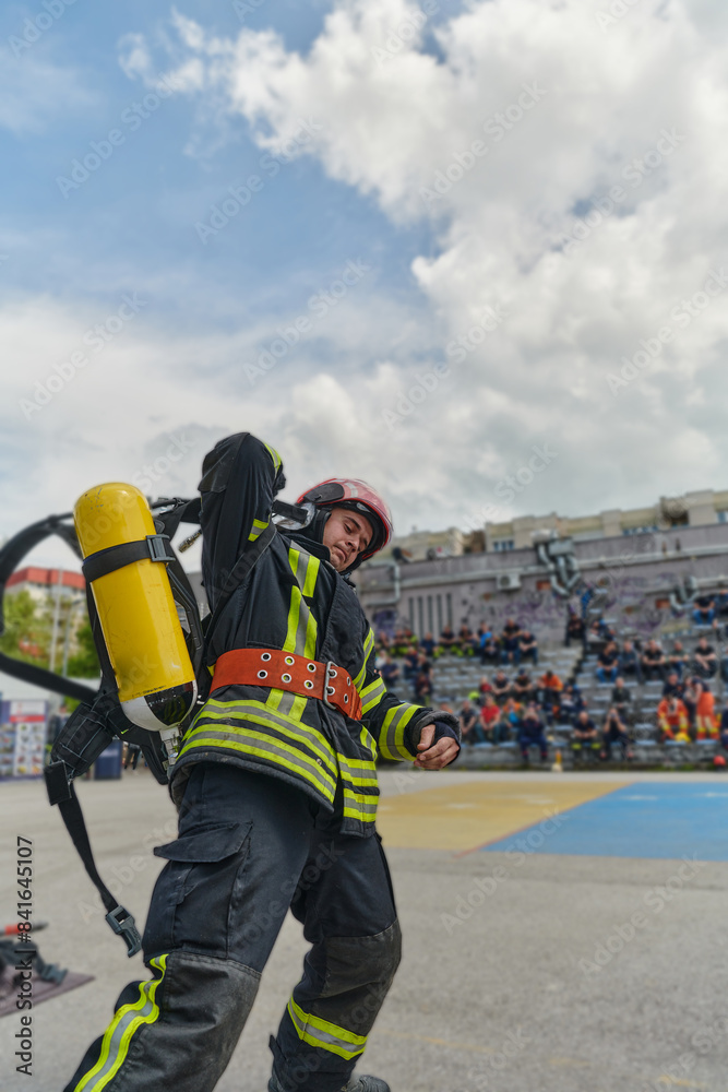 A firefighter dons the essential components of their professional gear, embodying resilience, commitment, and readiness as they gear up for a hazardous firefighting mission, a testament to their A firefighter dons the essential components of their professional gear, embodying resilience, commitment, and readiness as they gear up for a hazardous firefighting mission, a testament to their