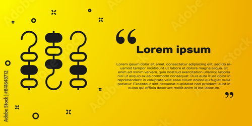 Black Grilled shish kebab on skewer stick icon isolated on yellow background. Meat kebab on skewer stick. Picnic with grilled meat. Vector