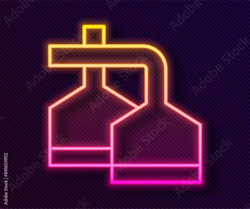 Glowing neon line Traditional brewing vessels in brewery icon isolated on black background. Beer brewing process. Distillery plant, brewery. Vector