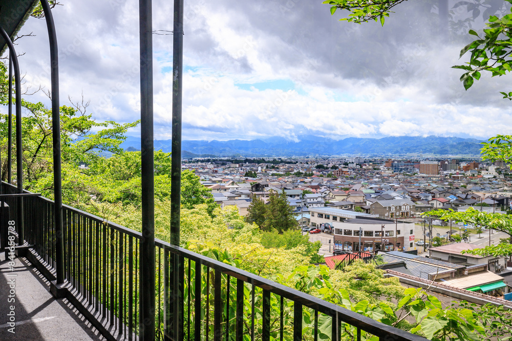 Fototapeta premium Panorama View from Iimori Mountain: Aizuwakamatsu’s Urban and Natural Harmony, Japan
