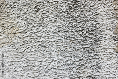 rough texture of uncemented gray wall close up for background photo