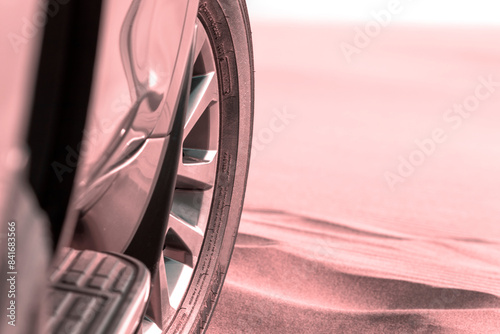 Canvas Print Close up of a golden car stuck in the sand in the Namib desert.