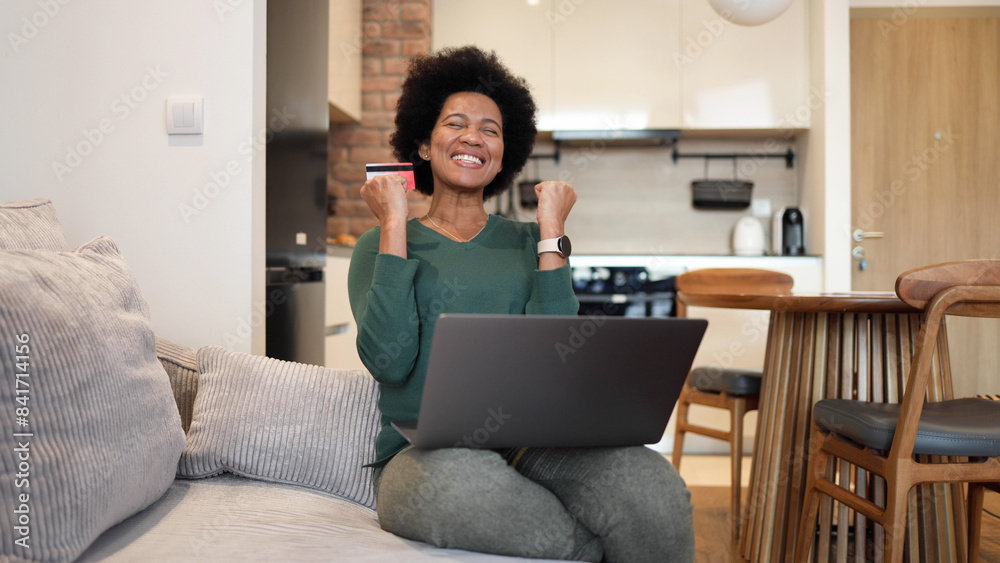 African American woman using laptop and shopping online African American woman using laptop and shopping online