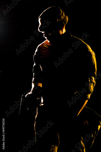 close-up at a professional shooting range military weapons trainer standing preparing to use a pistol © Guys Who Shoot