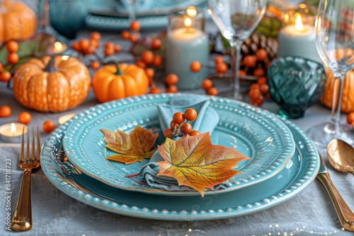 Autumnal Table Setting With Blue Plates, Pumpkins, and Berries