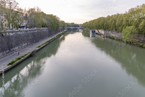 Rome, Italy - April 11, 2024: Rome, Italy - April 11, 2024: Views of the Tiber River as it passes through the city of Rome, Italy