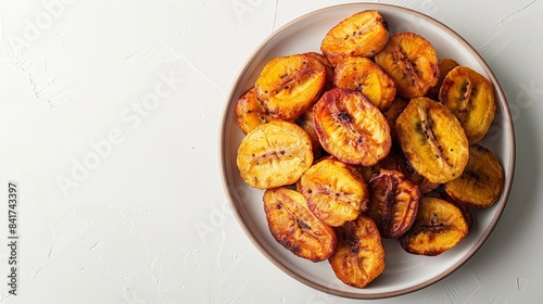 Lovely brown fried plantains formed in an array over an elongated  platter with a white setting offer a notion for a lovely side dish to enhance an evening's food and space, Generative AI.