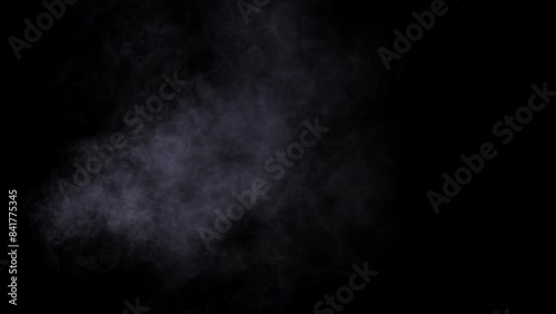 A Dark Smoke Cloud is seen isolated on a black background, moving artistically in the image photo