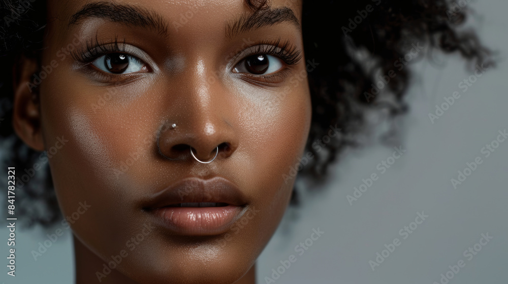 A stunning portrait featuring an individual with glowing skin, beautiful natural curls, and expressive eyes, highlighting the elegance and beauty of simplicity. A stunning portrait featuring an individual with glowing skin, beautiful natural curls, and expressive eyes, highlighting the elegance and beauty of simplicity.