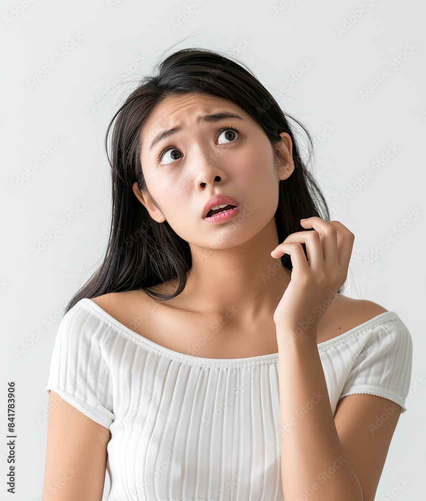 Portrait of a confused Asian young woman in white top isolated on white background, copy space. AI Portrait of a confused Asian young woman in white top isolated on white background, copy space. AI