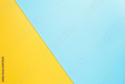 Two tone background featuring vivid yellow and blue colors separated by a diagonal line  providing a simple yet vibrant backdrop