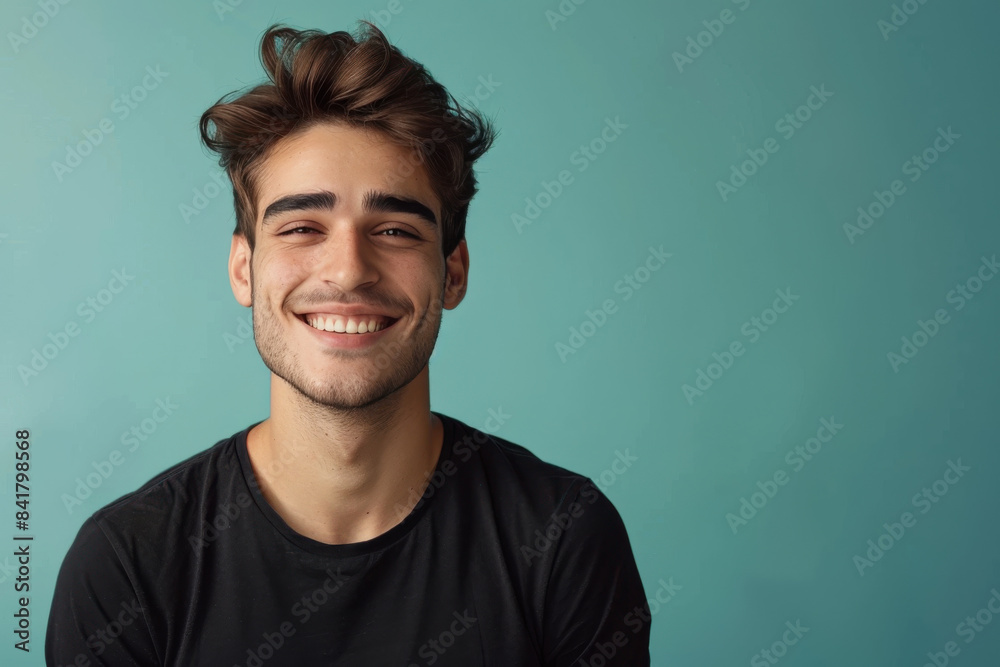 Obraz premium A close up portrait of a young man with a subtle smile
