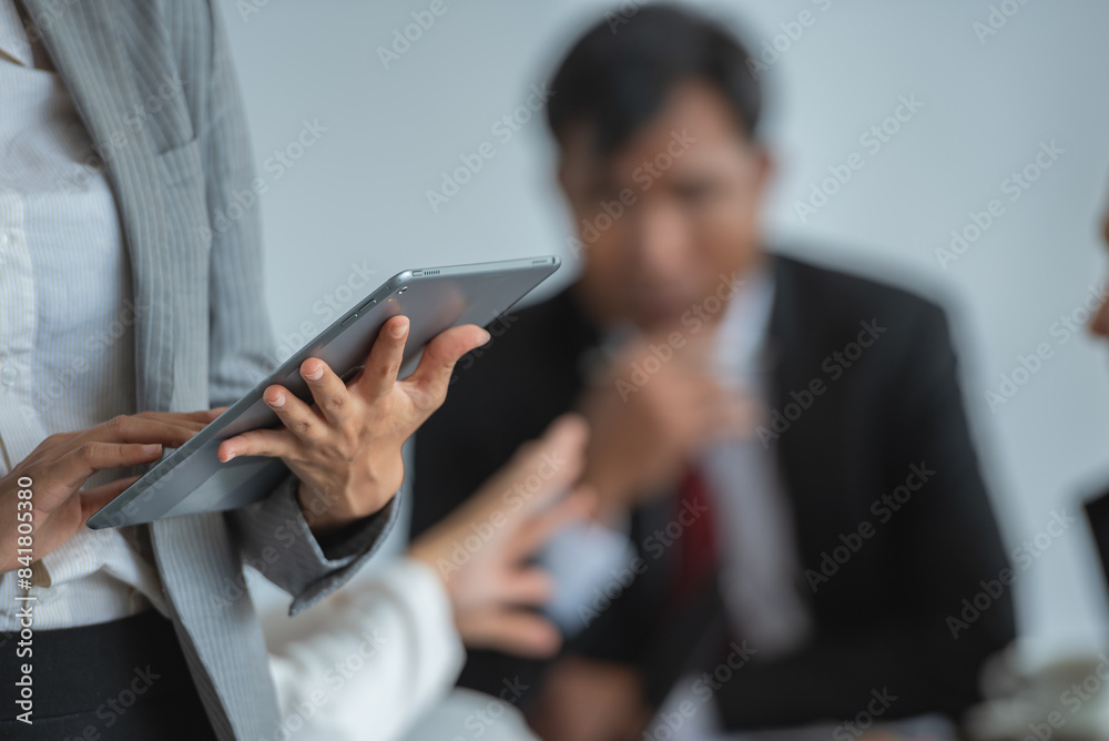 Businesswoman using tablet for presentation in the meeting Businesswoman using tablet for presentation in the meeting