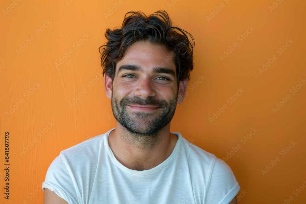 A close up portrait of a young man with a subtle smile A close up portrait of a young man with a subtle smile