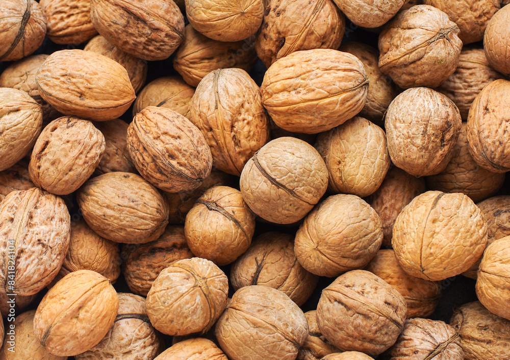 Top view of whole walnuts as background texture Top view of whole walnuts as background texture