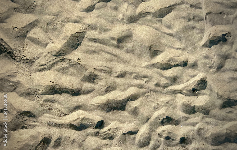 Photo of the sand of a portion of the beach. Idea for background Photo of the sand of a portion of the beach. Idea for background