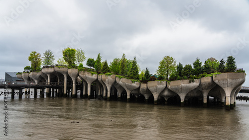 Modern floating park with tulip-shaped pillars in water photo