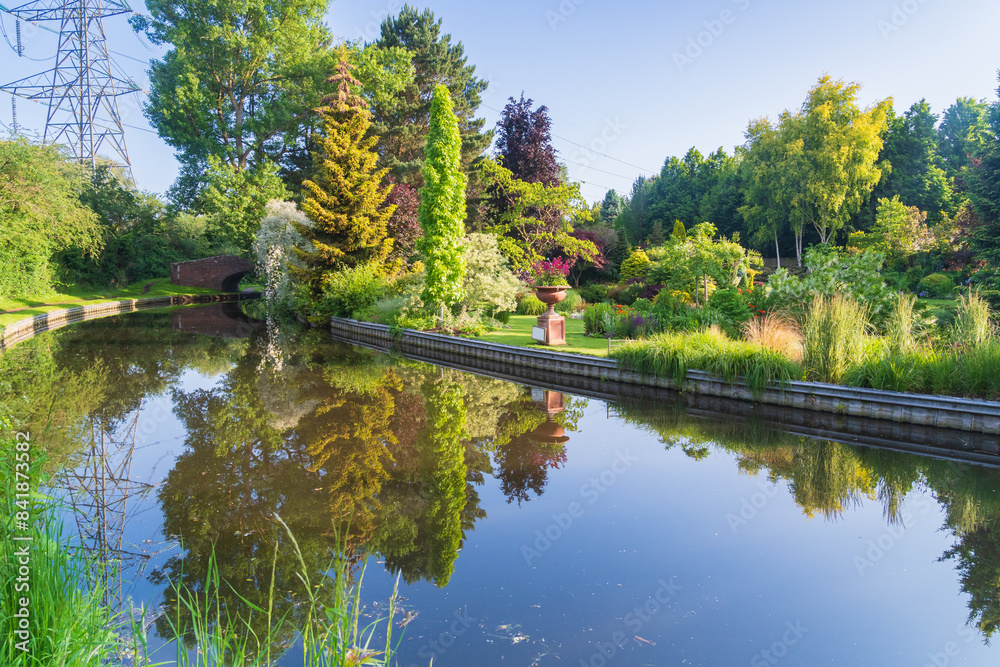 Beautiful, colourful, blooming garden on the canal in the UK Beautiful, colourful, blooming garden on the canal in the UK