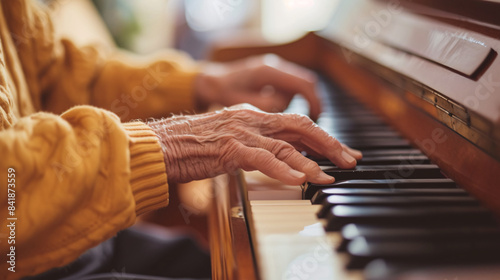 A senior man playing the piano, his fingers dancing across the keys as he fills the room with music.