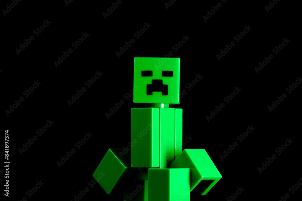 Fototapeta premium LEGO Minecraft green Creeper Mob on the black background