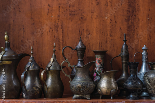 Traditional Omani metalware on wooden background