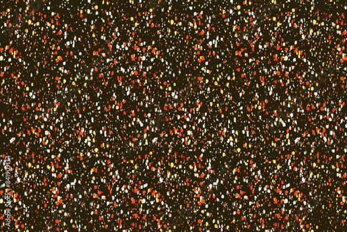 Abstract colorful speckled pattern on a dark backdrop