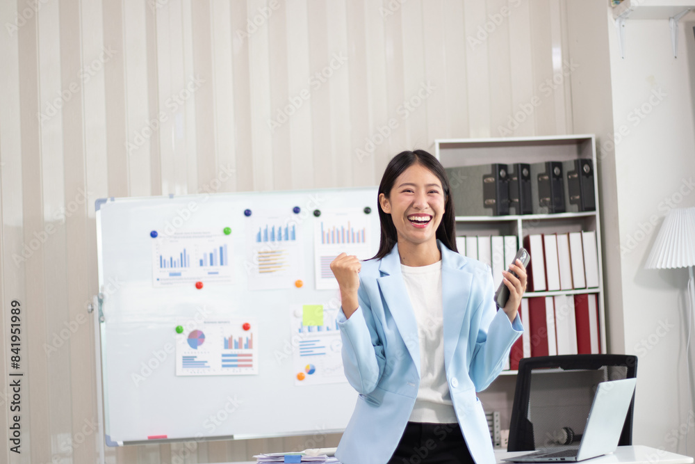 Beautiful Asian business woman uses digital tablet and laptop to do remote work at the office, online seminar or video call. Beautiful Asian business woman uses digital tablet and laptop to do remote work at the office, online seminar or video call.