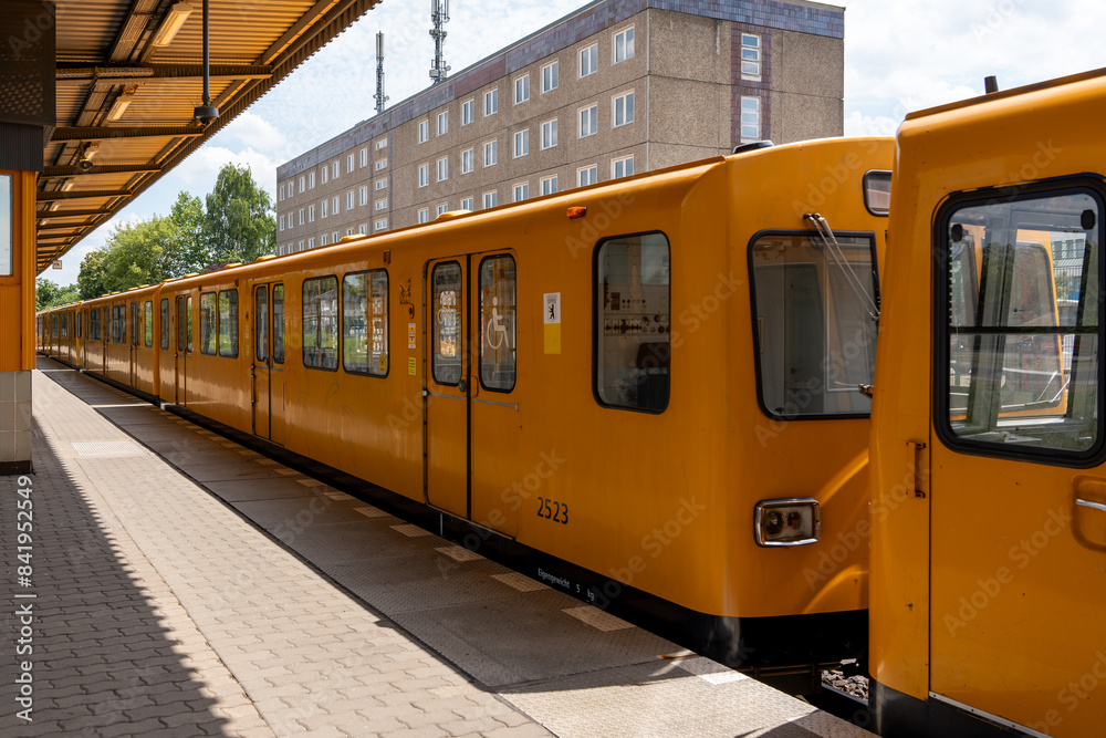 Naklejka premium Old yellow underground train of the city of Berlin. Underground train at the station.