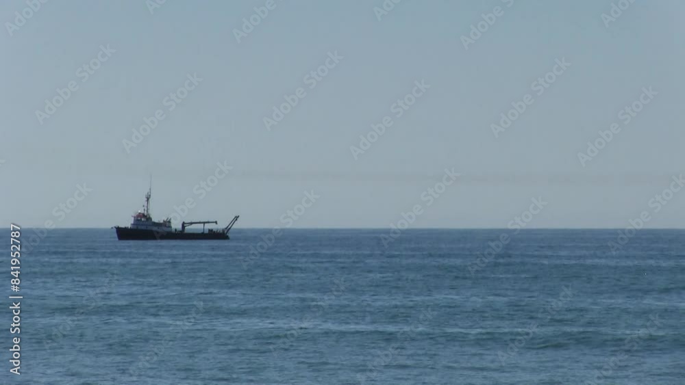 Fishing Boat Sitting Offshore Southern California Rocking Gently In the Ocean Waves
Fishing Boat Sitting Offshore Southern California Rocking Gently In the Ocean Waves