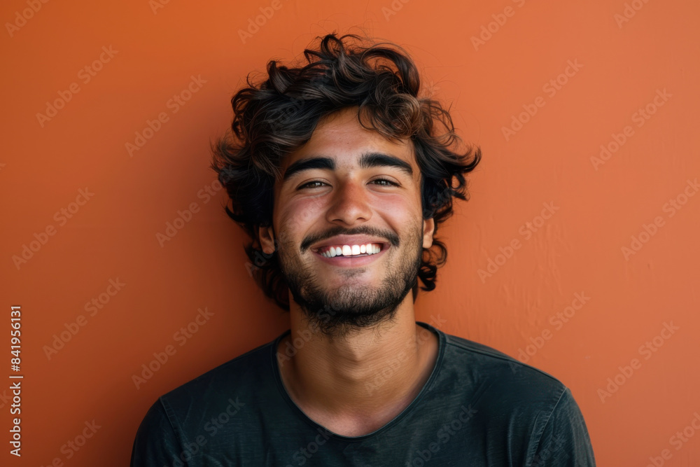 A close up portrait of a young man with a subtle smile A close up portrait of a young man with a subtle smile
