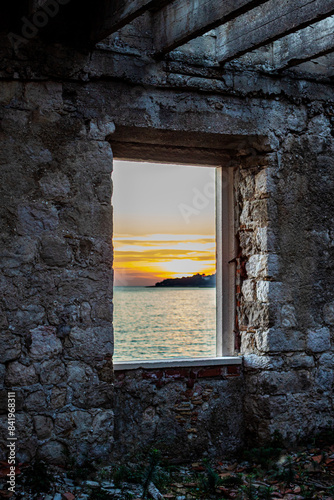 Croatian sunset over the ocean through a window
