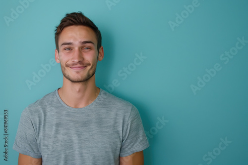 A close up portrait of a young man with a subtle smile © MagnusCort