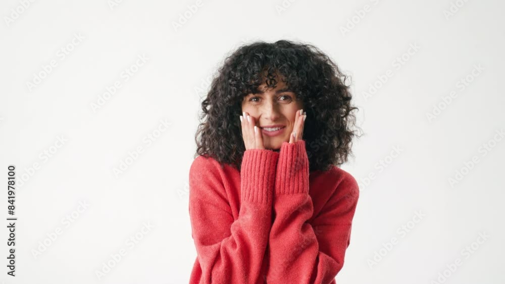 Frontal view of pretty Caucasian woman. Girl laughing and smiling while looking directly at camera. Placing both hands on face. Expressing emotions. Showing surprised facial expression. Frontal view of pretty Caucasian woman. Girl laughing and smiling while looking directly at camera. Placing both hands on face. Expressing emotions. Showing surprised facial expression.