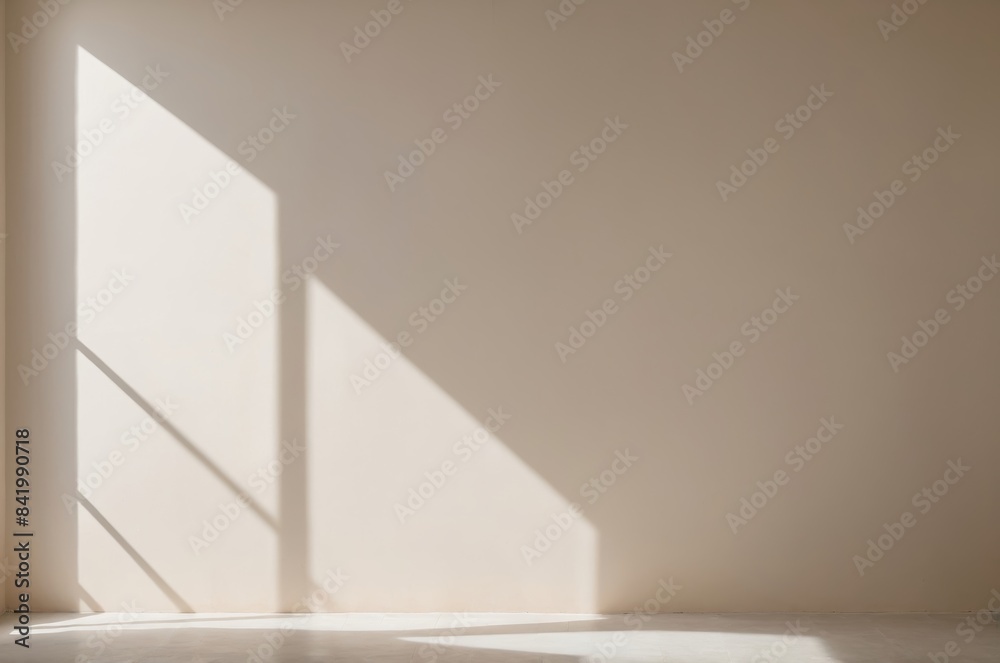 Minimalistic elegance light beige wall with gentle window shadow on sunny day