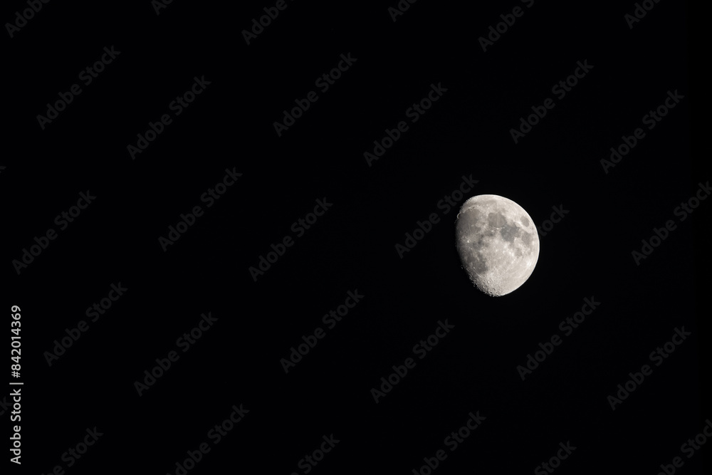 The Moon in the Waxing gibbous Lunar phase (view from Northern Hemisphere) on a dark night sky The Moon in the Waxing gibbous Lunar phase (view from Northern Hemisphere) on a dark night sky