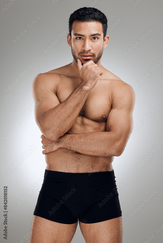 Fototapeta premium Portrait, body skin and man for muscle development with exercise aesthetic and results for sport in studio. Shirtless, stripper guy and strong abdomen with abs for sensual figure by grey background