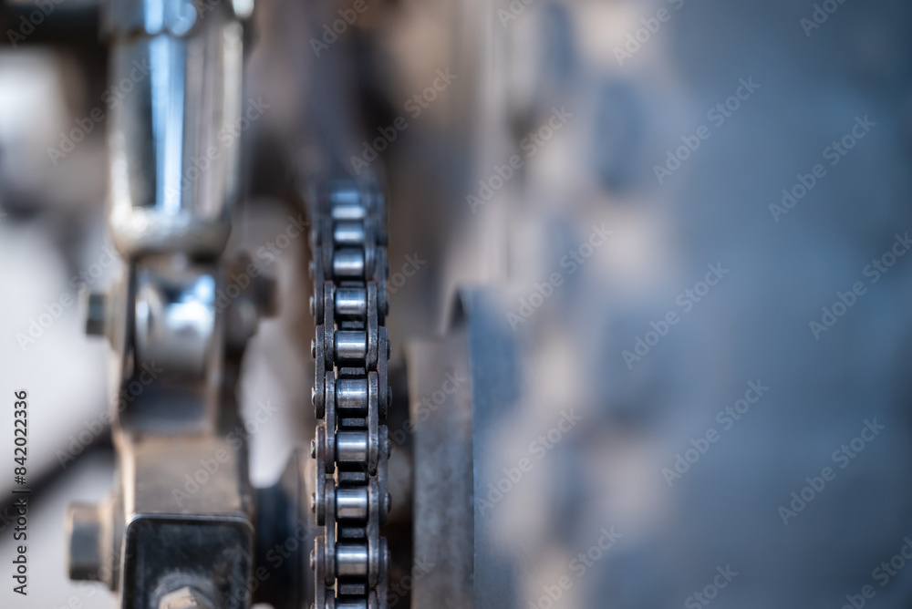 Close up of motorbike chain. Dirty motorbike chain on rear wheel Close up of motorbike chain. Dirty motorbike chain on rear wheel