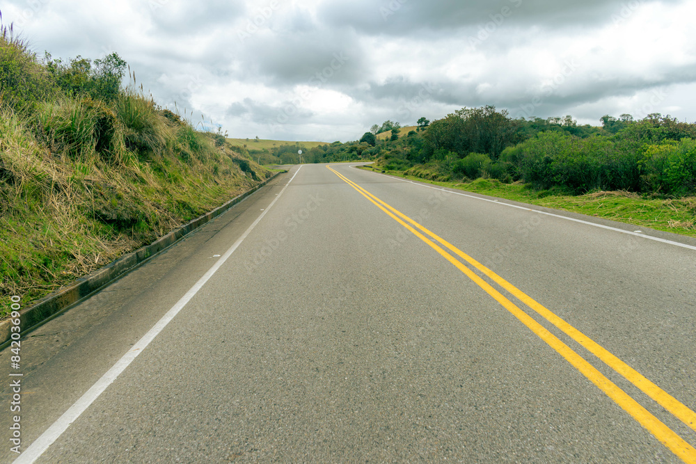 mountainous landscape with a road that disappears into the horizon mountainous landscape with a road that disappears into the horizon