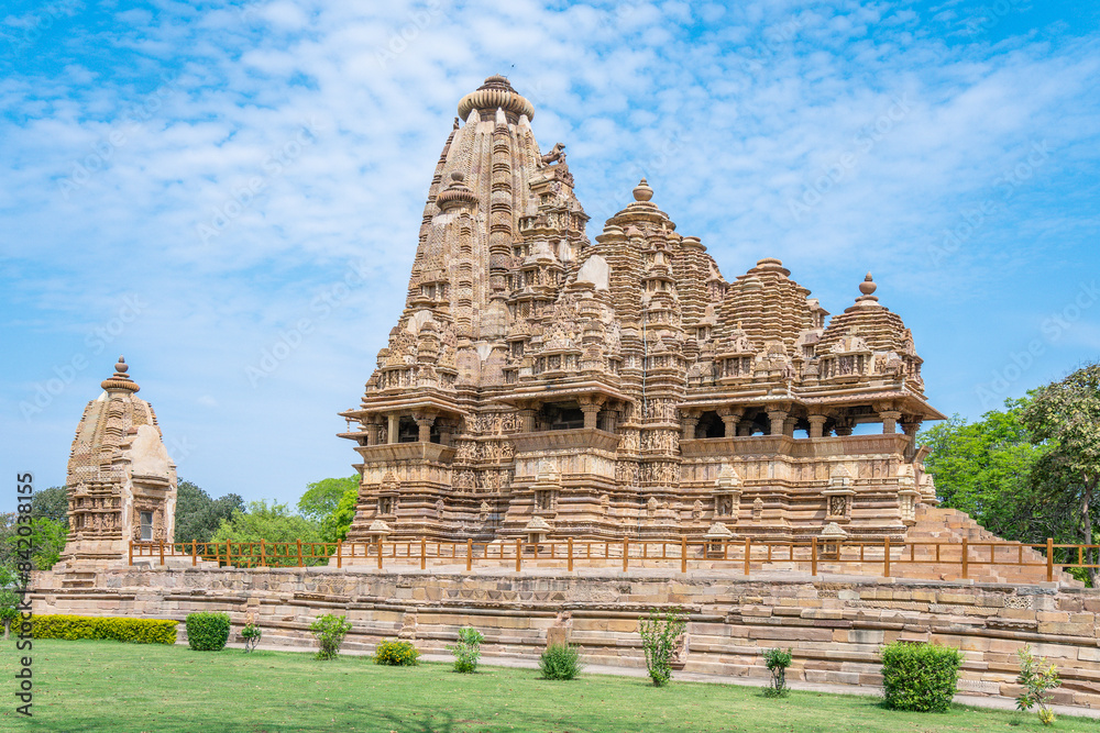 Ancient Hindu Temple in Khajuraho with Intricate Stone Carvings Ancient Hindu Temple in Khajuraho with Intricate Stone Carvings